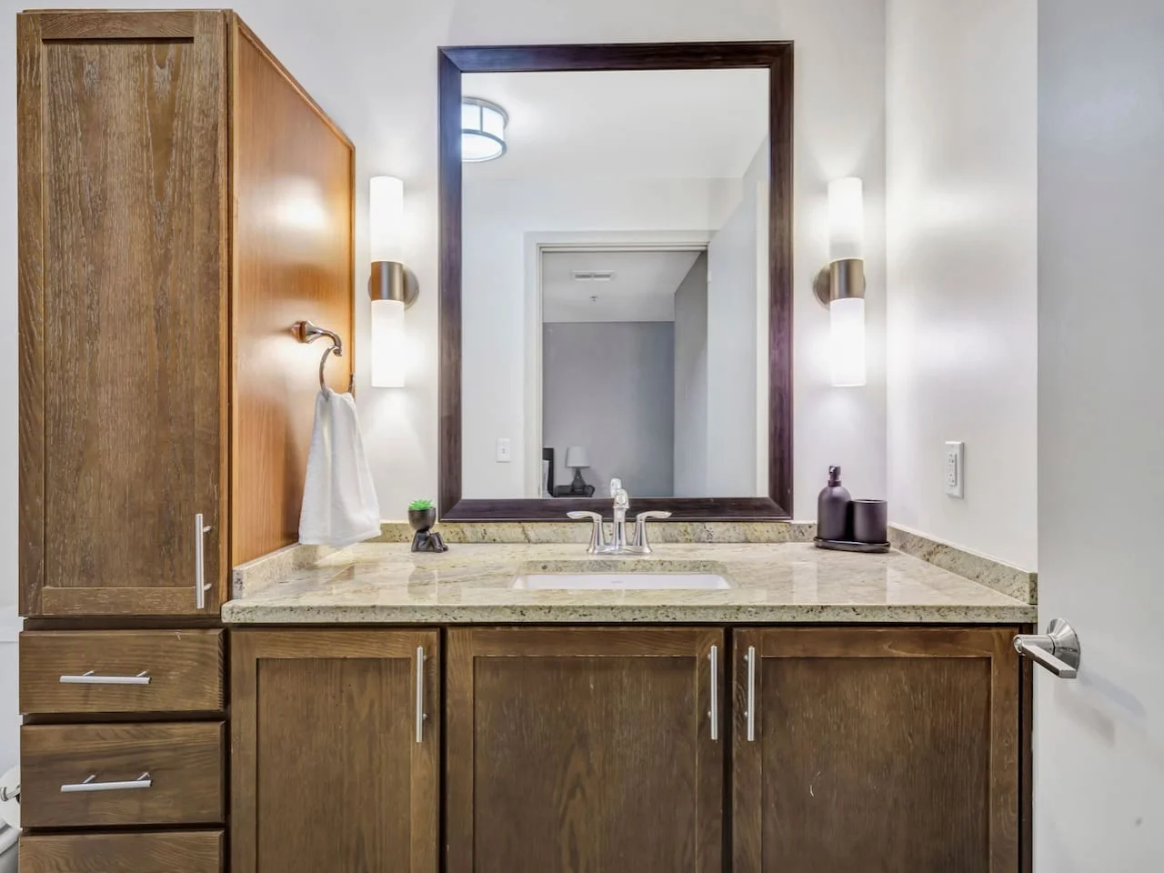 You feel a sense of calm as you enter the bathroom, where the thoughtful design and high-quality materials create a serene environment.