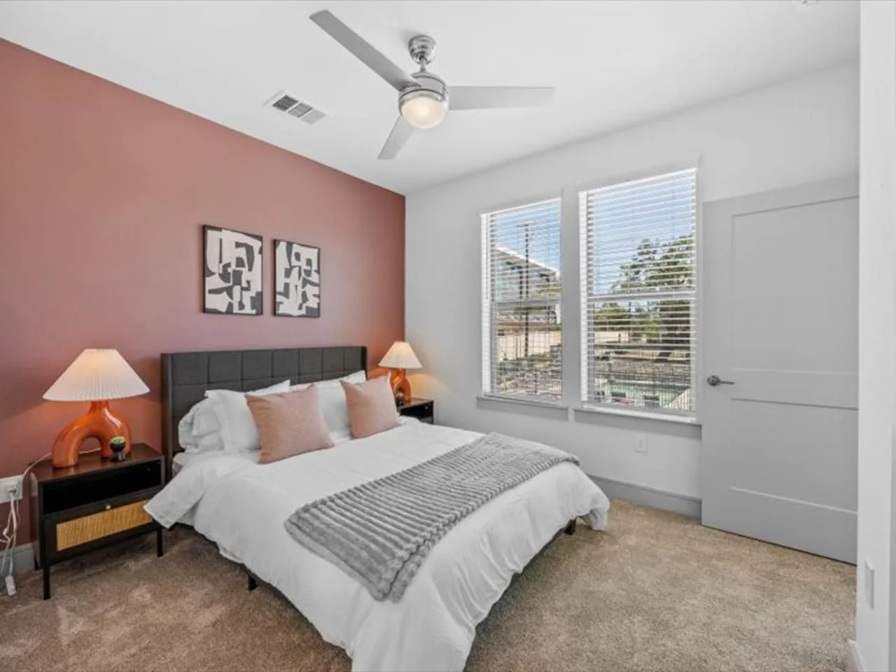 The bedroom offers a luxurious retreat, with a bed that promises restful nights and a room that feels like a private oasis.