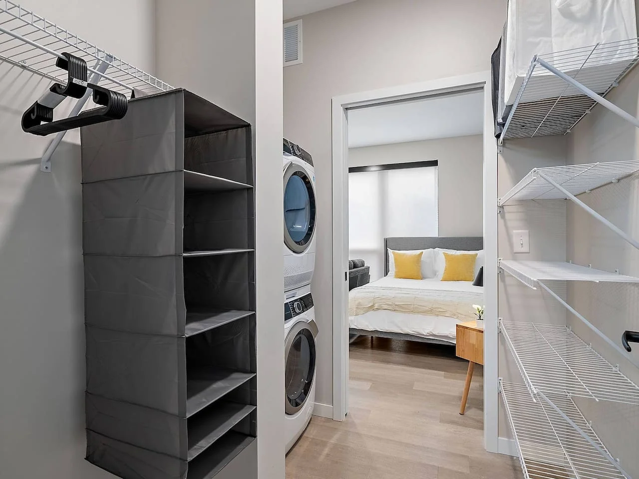 Laundry room with a washer, dryer, and folding area, offering all the convenience you need for a comfortable extended stay.