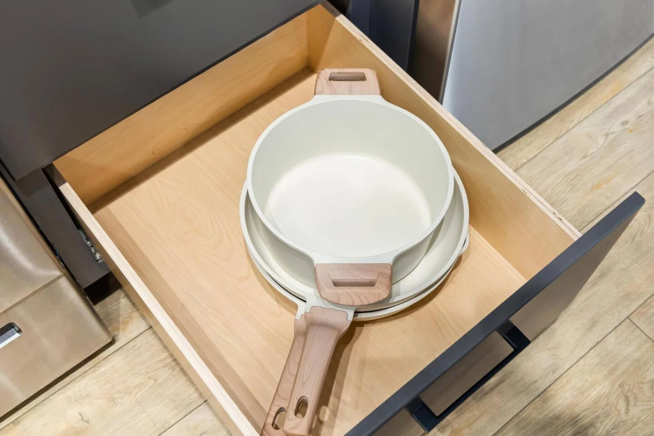 Kitchen cabinets stocked with cooking wares, glassware and silverwares, ideal for mixing up your favorite meals and drinks during your stay.
