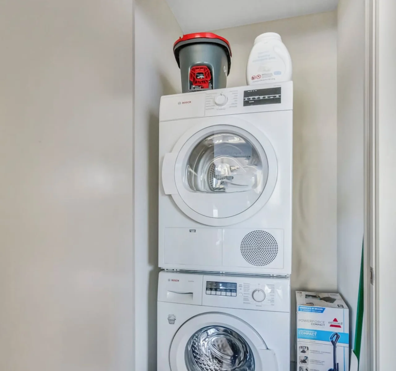 Convenient laundry room with washer, dryer, and all necessary supplies, making it easy to take care of your laundry needs.