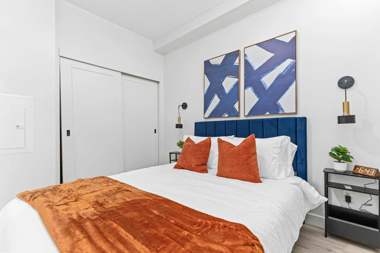 Comfortable Queen size bed - Side tables - Bedside lamps - Wall art - Area rug - Alarm clock, Extra pillows w/ Throw blanket - Full size closet w/ sliding doors.