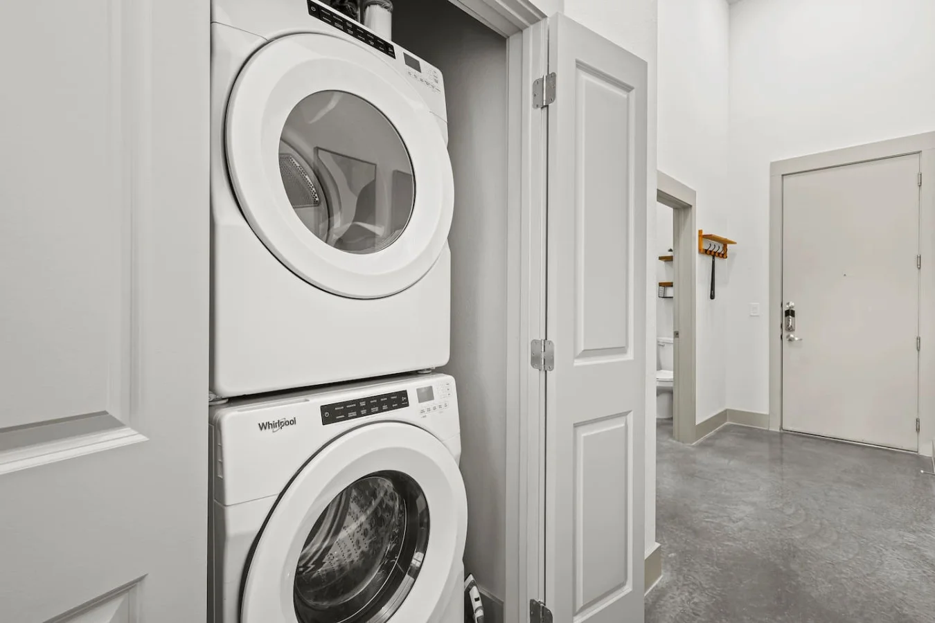 Convenient laundry room with washer, dryer, and all necessary supplies, making it easy to take care of your laundry needs.