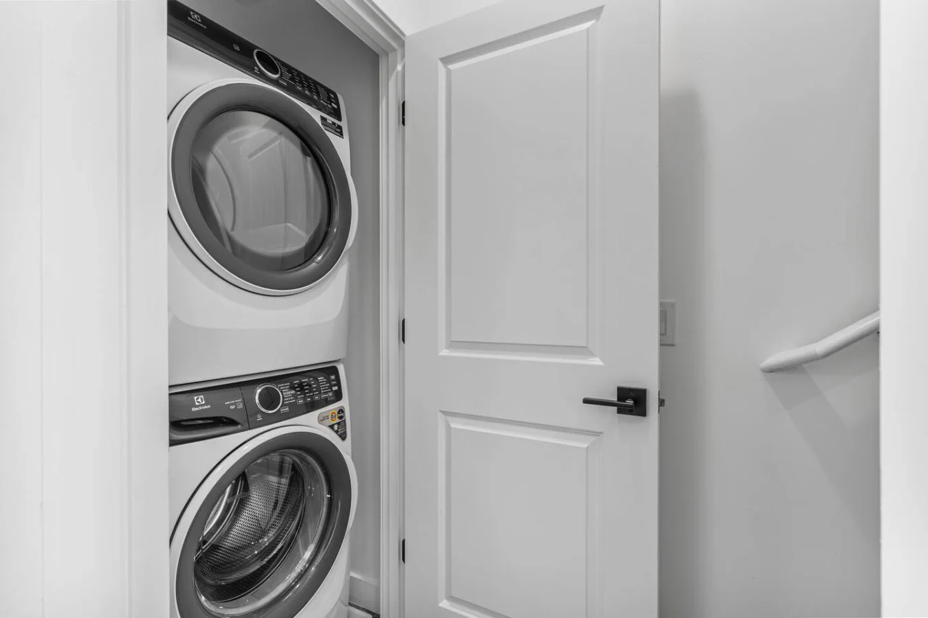 Convenient laundry room with washer, dryer, and all necessary supplies, making it easy to take care of your laundry needs.