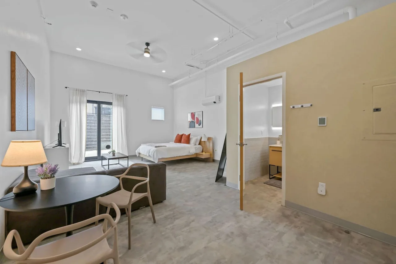 An open-concept area featuring a modern furnishings, and a stylish entertainment setup—ideal for gatherings and relaxation.