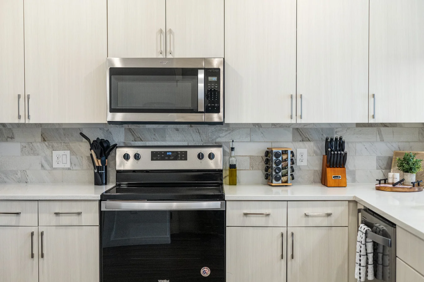Sleek and fully equipped kitchen featuring modern appliances and ample space for preparing your favorite meals.