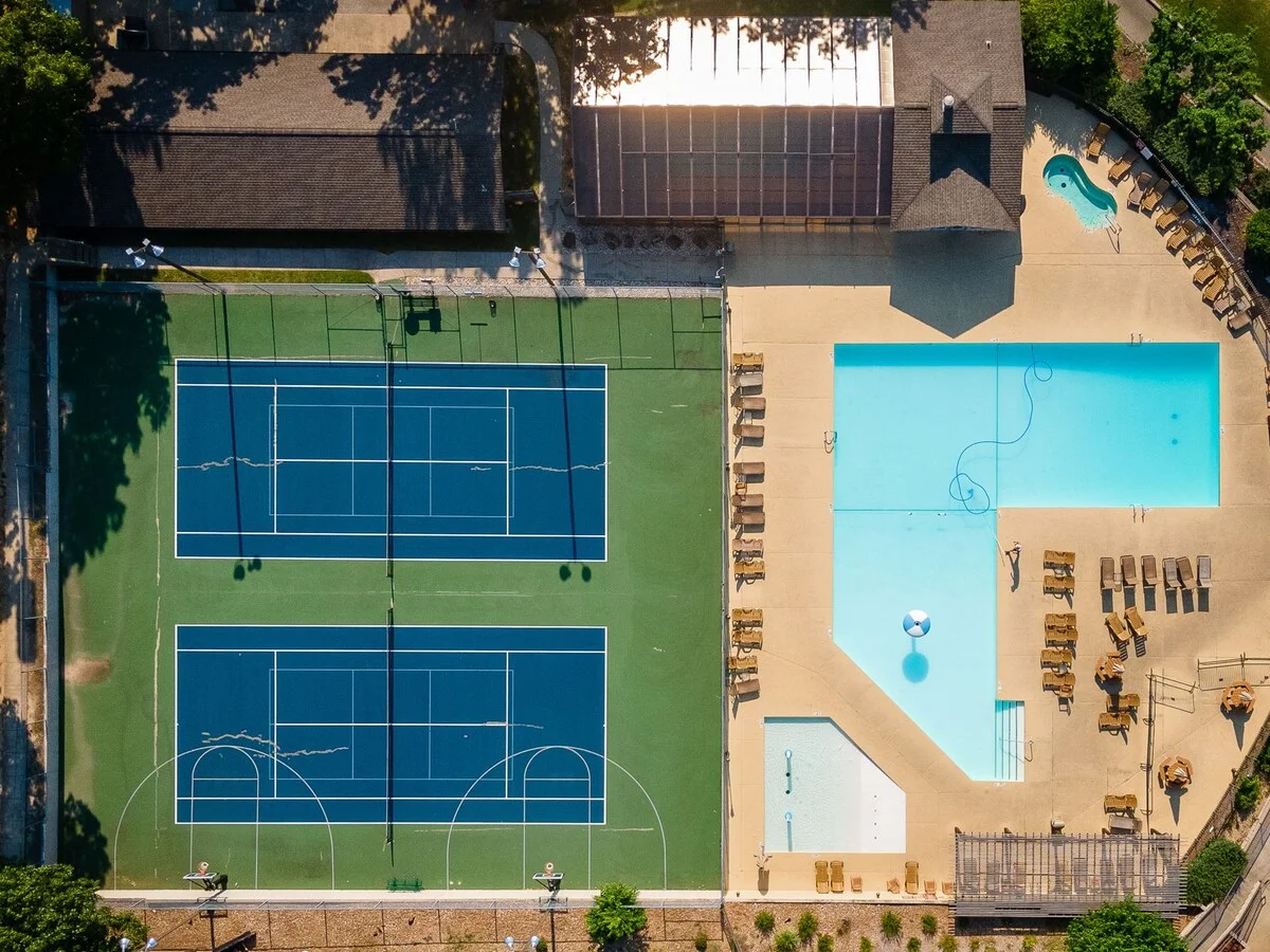 Ariel view of pool, basketball, and tennis courts.