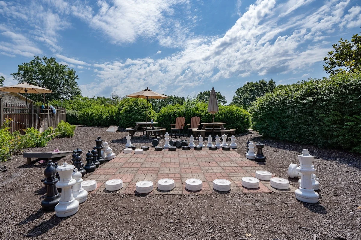 Outdoor games are across from the pool.