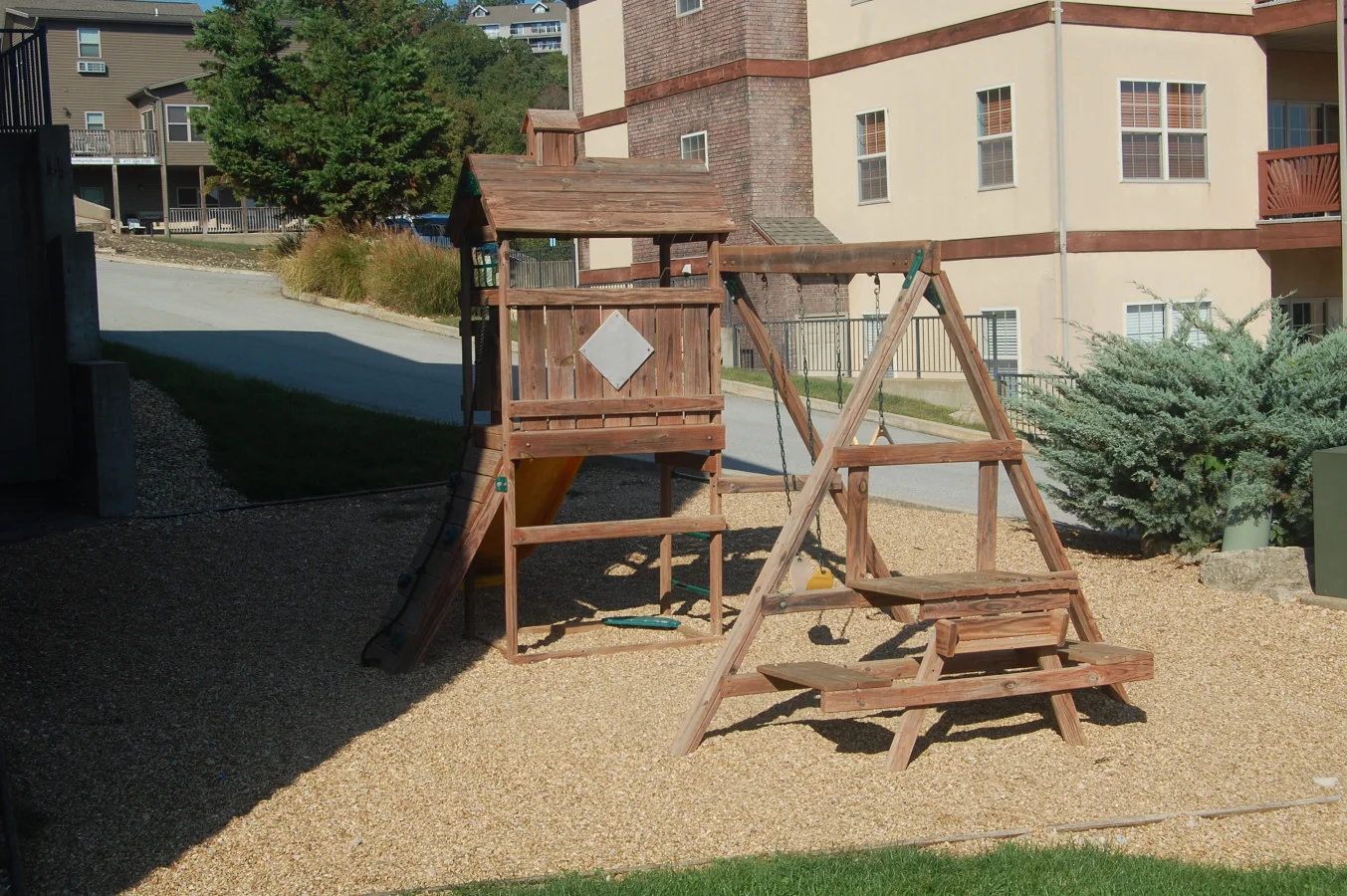 A family-friendly outdoor play set with swings, a slide, and climbing features — great for keeping kids active and entertained during your stay.