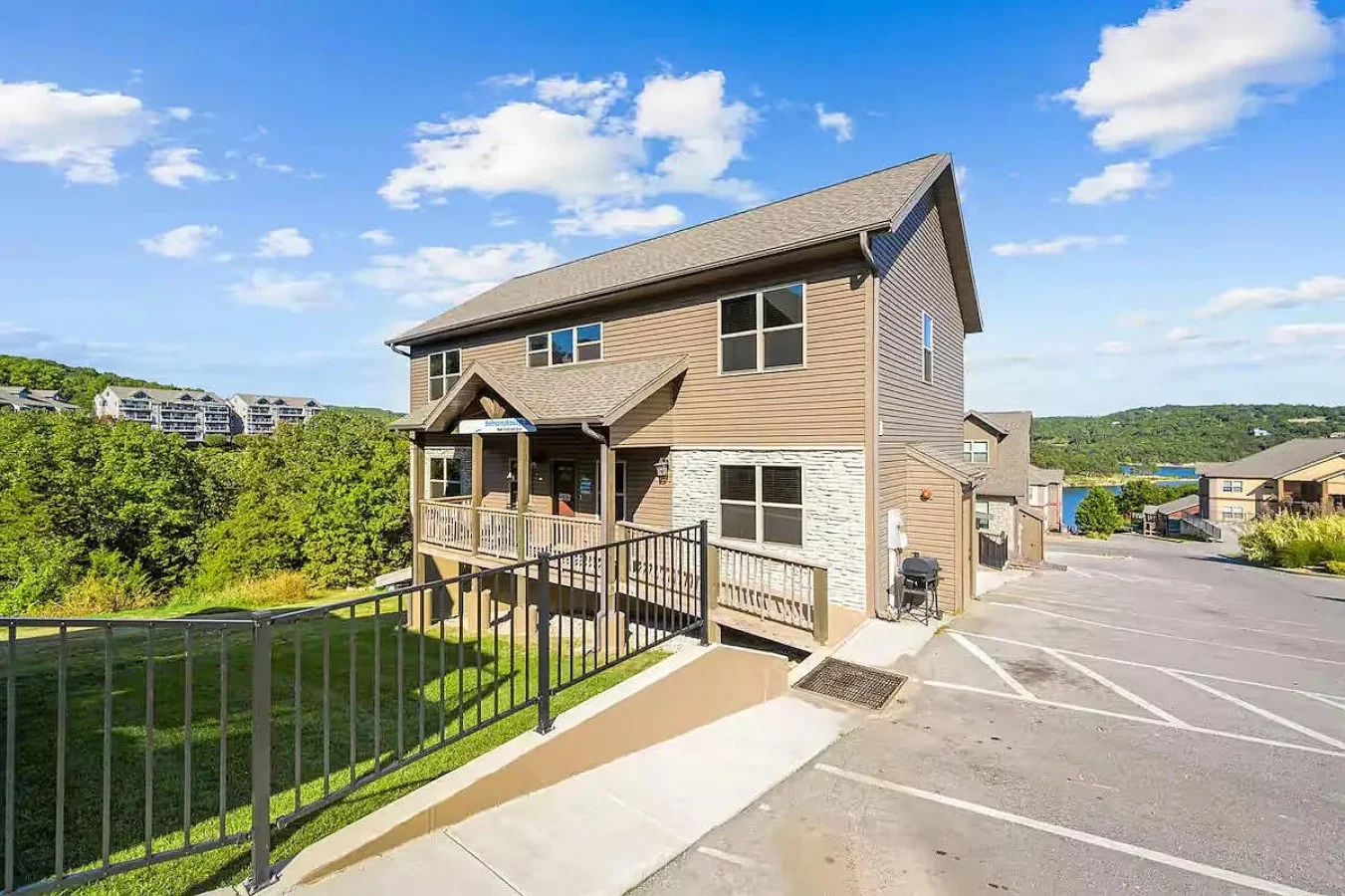 Welcome to your spacious lake retreat, featuring step-free main-level access and Table Rock Lake just down the hill.