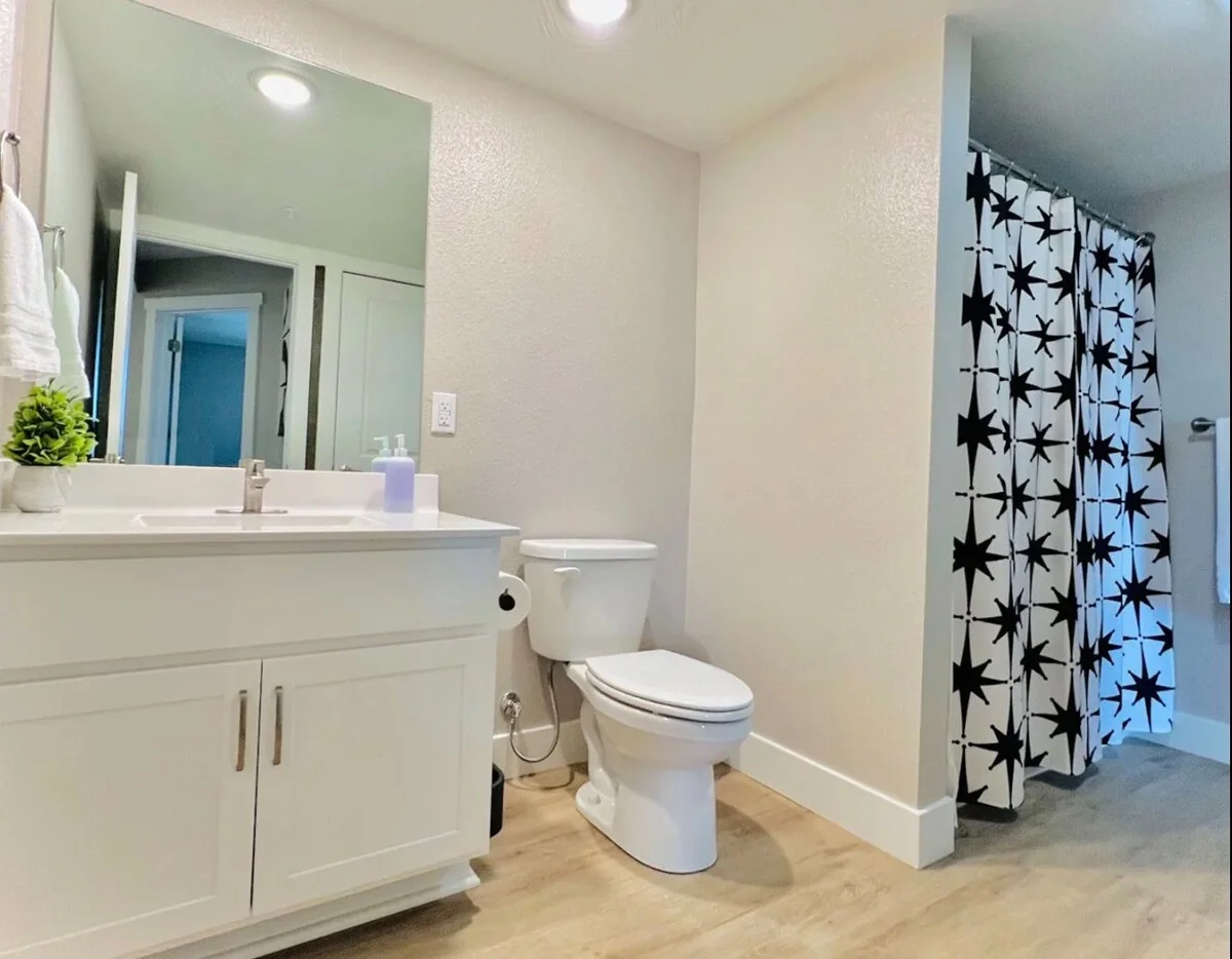 Large clean bathroom with tub and shower