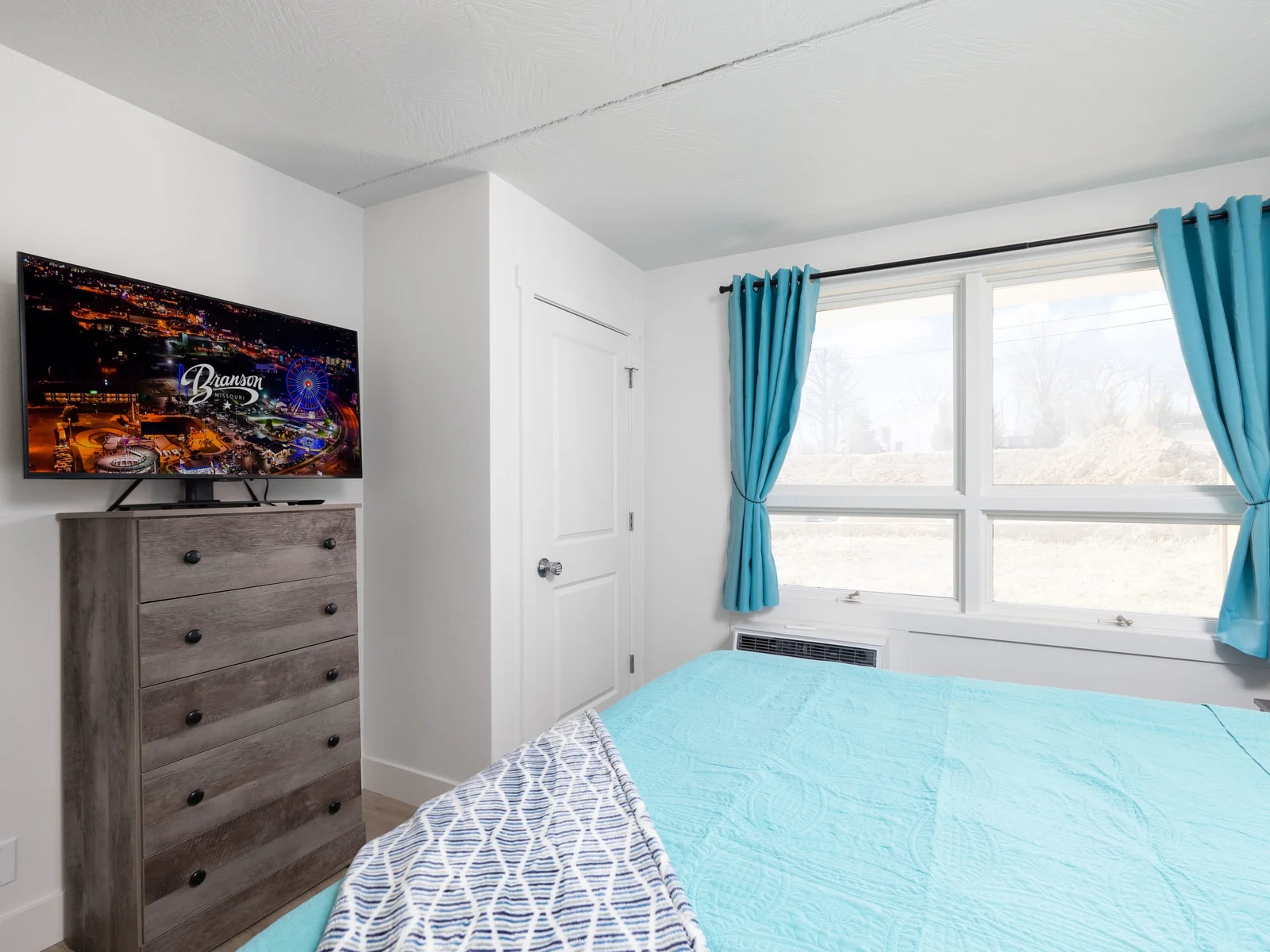 King Suite offers a side chair and 45" Insignia FireTV.