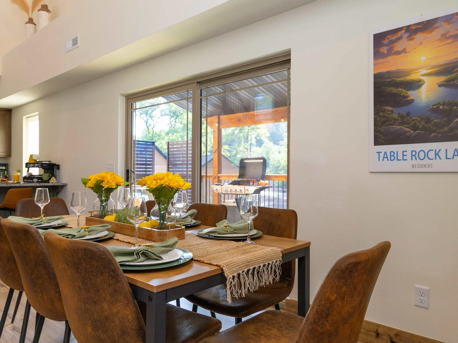 Framed by the ambient glow of the nearby fireplace and illuminated by natural light streaming through expansive windows, this space invites everything from leisurely brunches to festive family feasts.