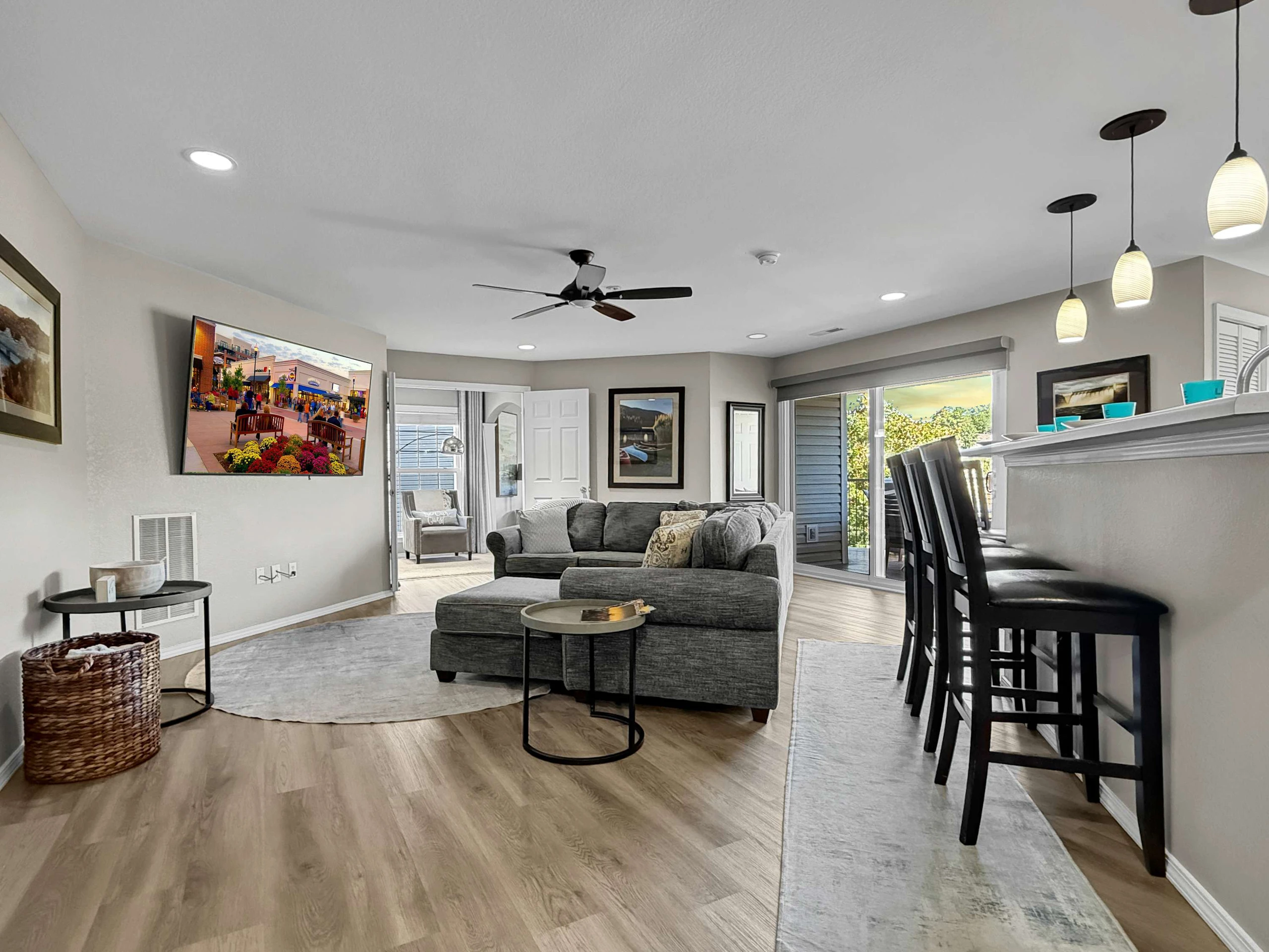 Large living area with huge streaming tv and breakfast bar