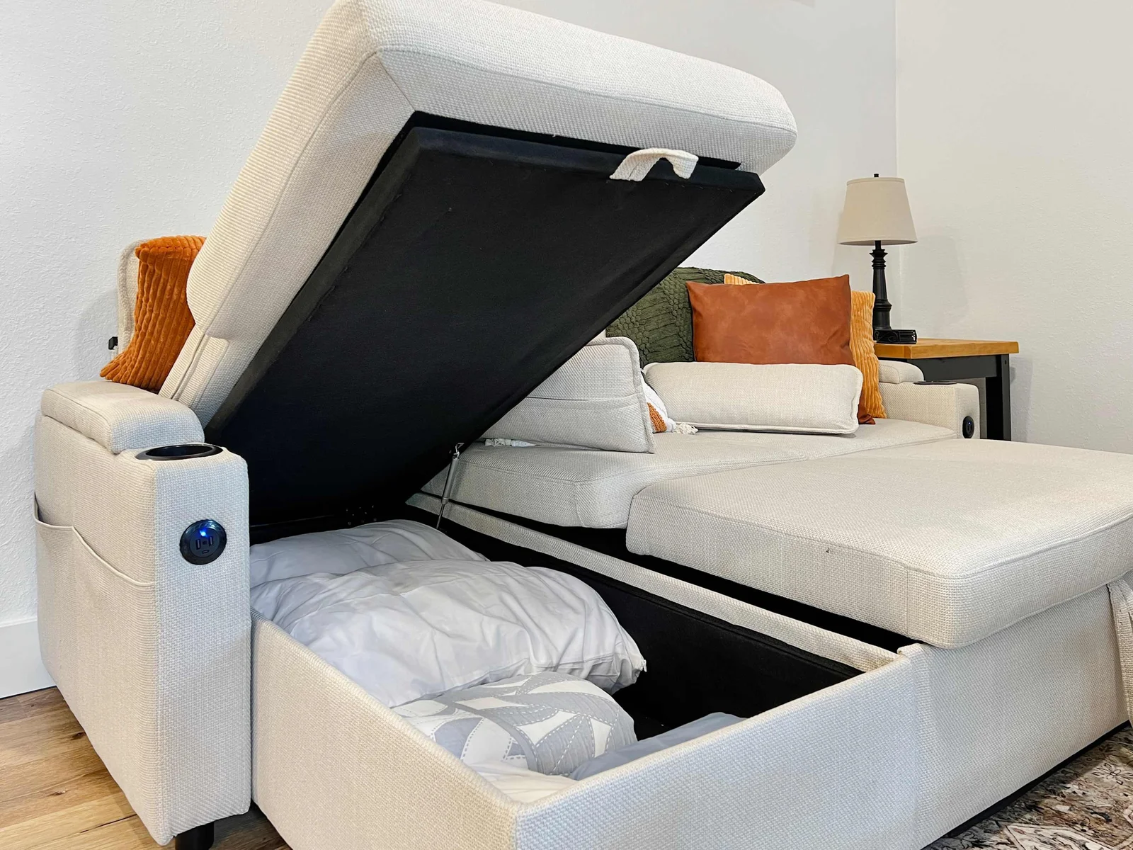 Storage under the sofa for the extra sheets, pillow and pillow case