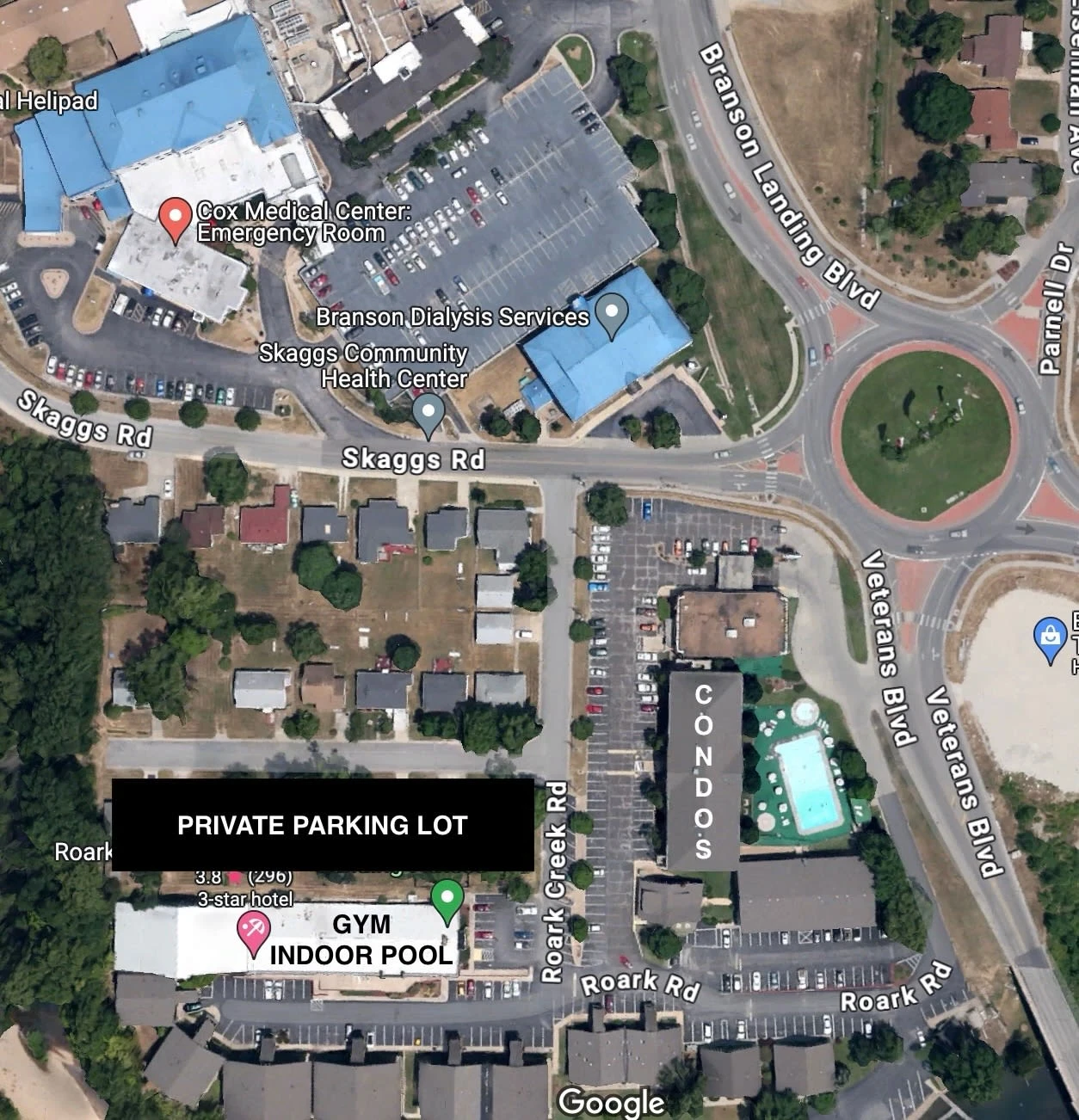 Overview of the property including Condos, Gym, Indoor pool, Cox Medical and roundabout