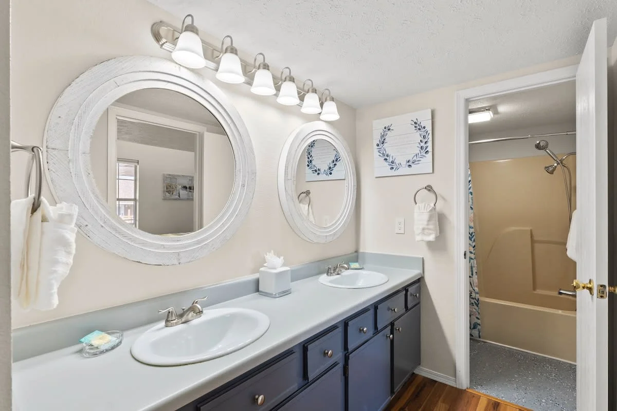 dual vanity and tub and shower