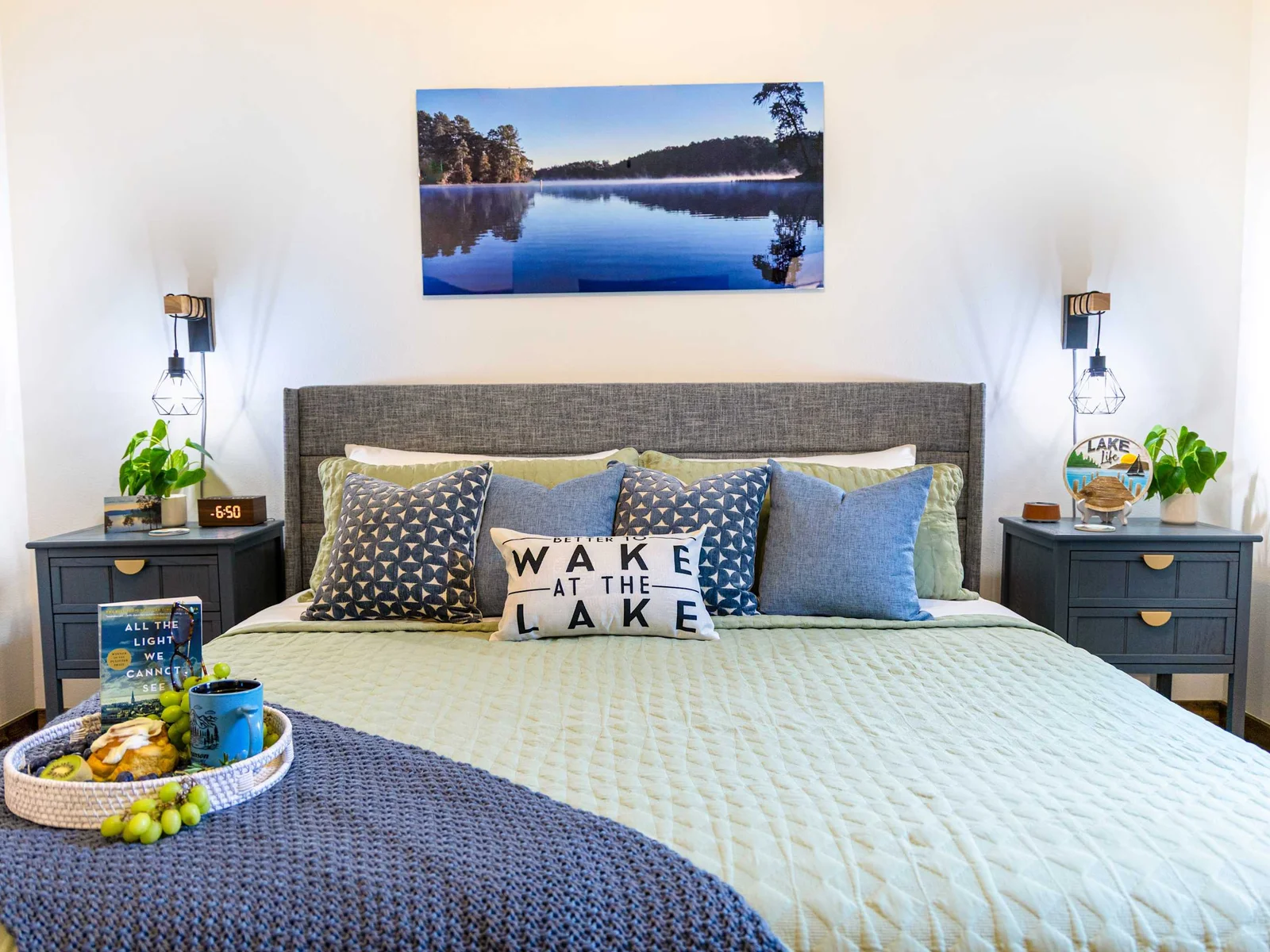 Step into a sanctuary of serenity in this upstairs primary suite, designed to echo the soothing rhythm of nearby Table Rock Lake.