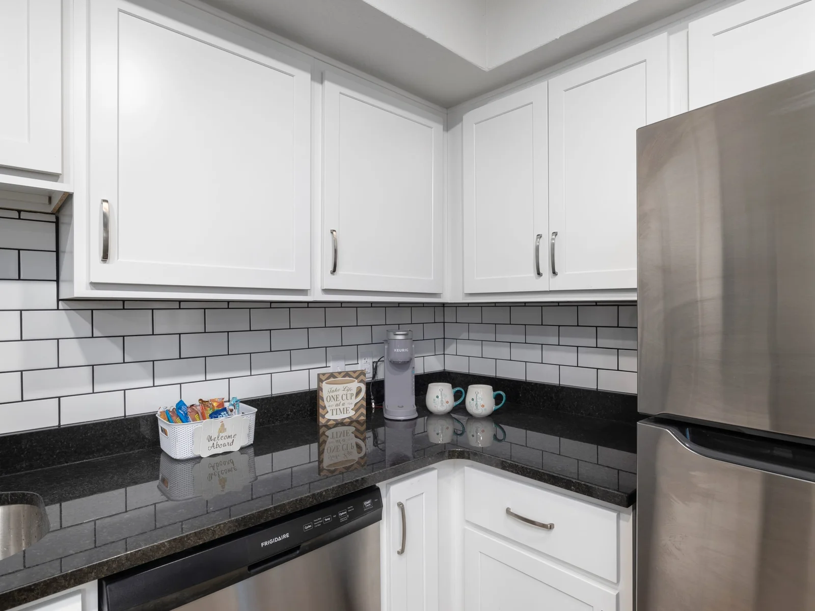 Grab your morning coffee from the coffee station with Keurig coffeemaker and coffee supplies.