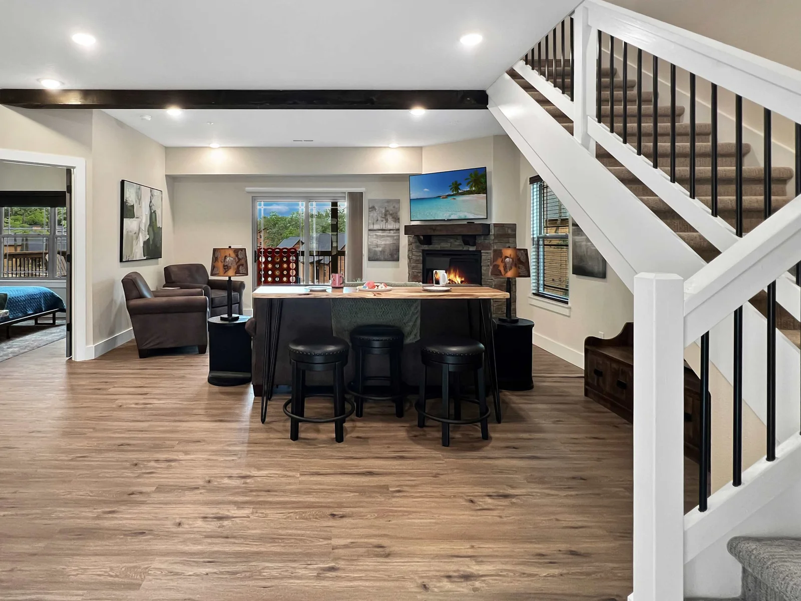 Expansive living area with extra tall ceilings and beautiful flooring along with luxurious furniture, host provided pack and play and high chair and so much more