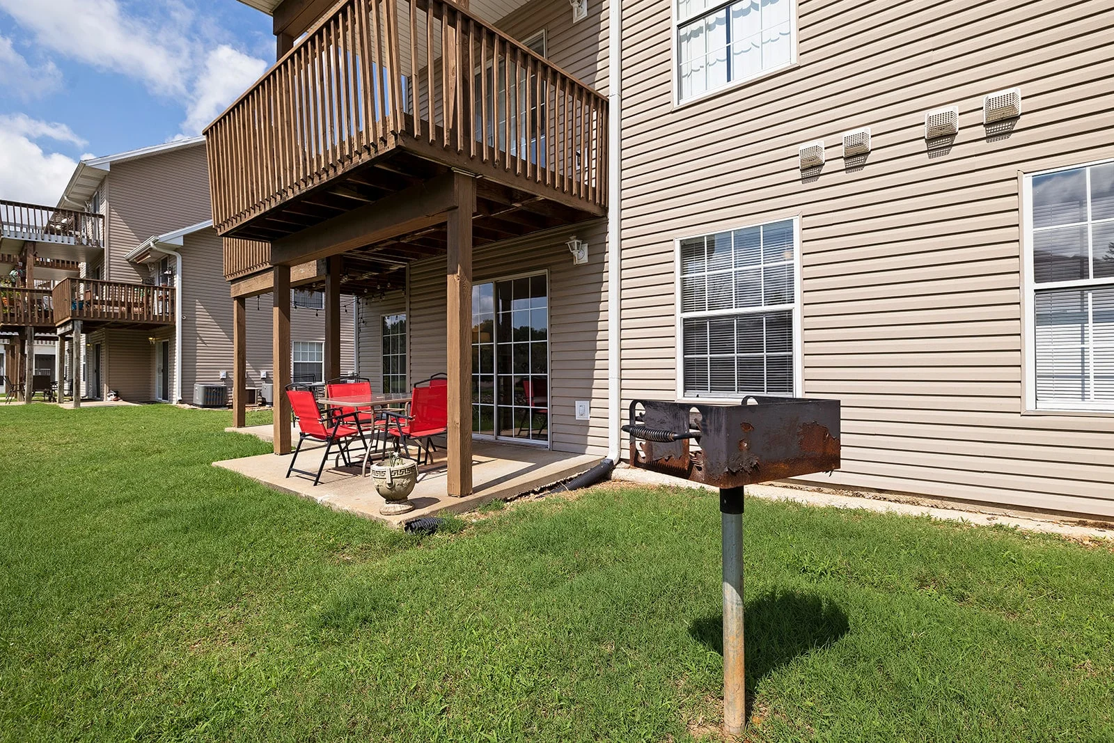 Covered outdoor patio with charcoal grill