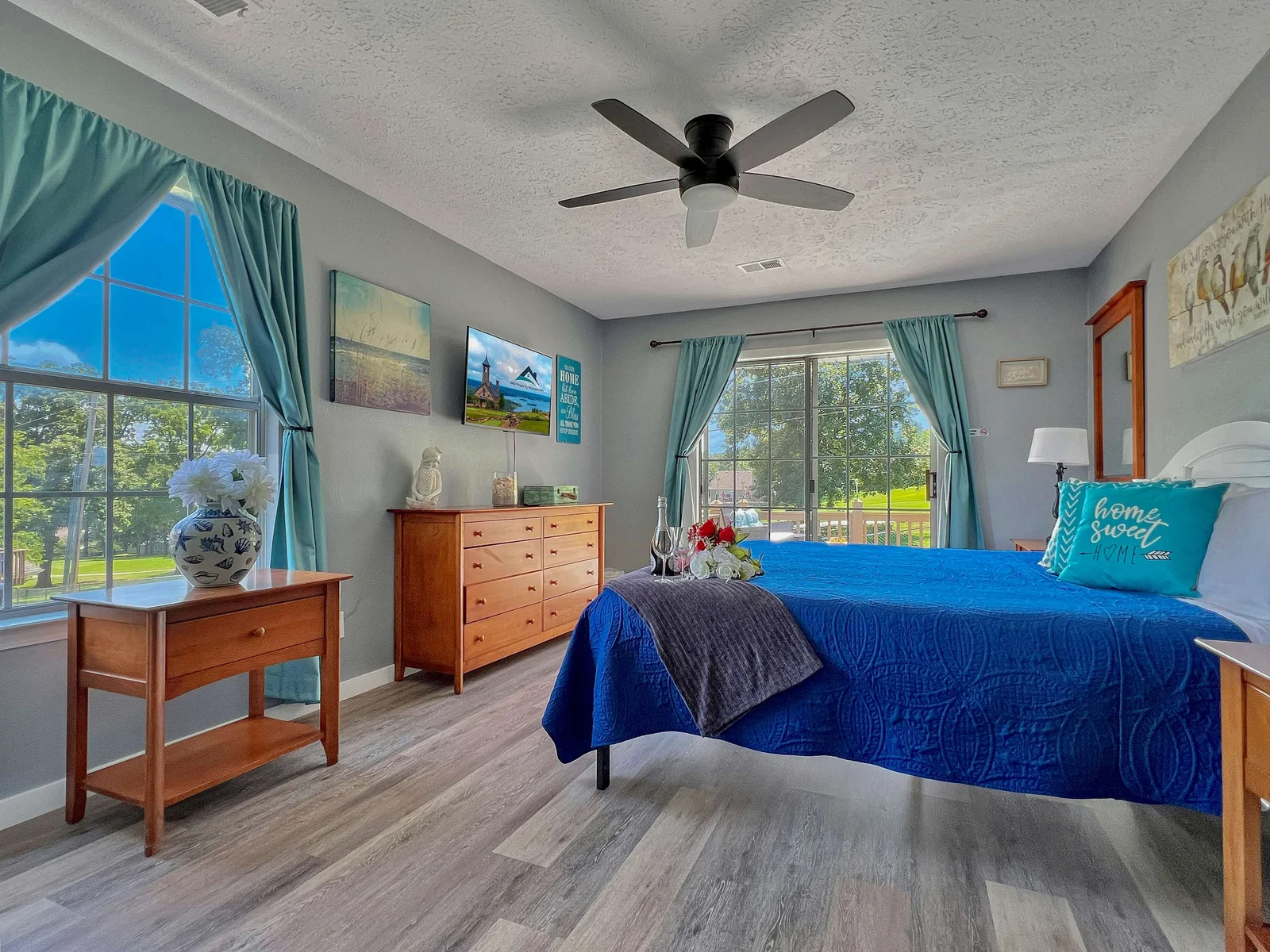 Beautiful master bedroom with king size bed and sliding doors on the patio