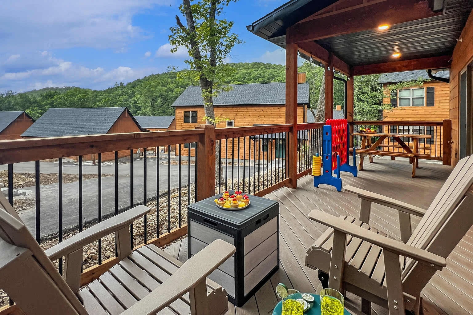 Beautiful partially covered large deck with picnic table, outdoor furniture, giant games, gas grill and more.