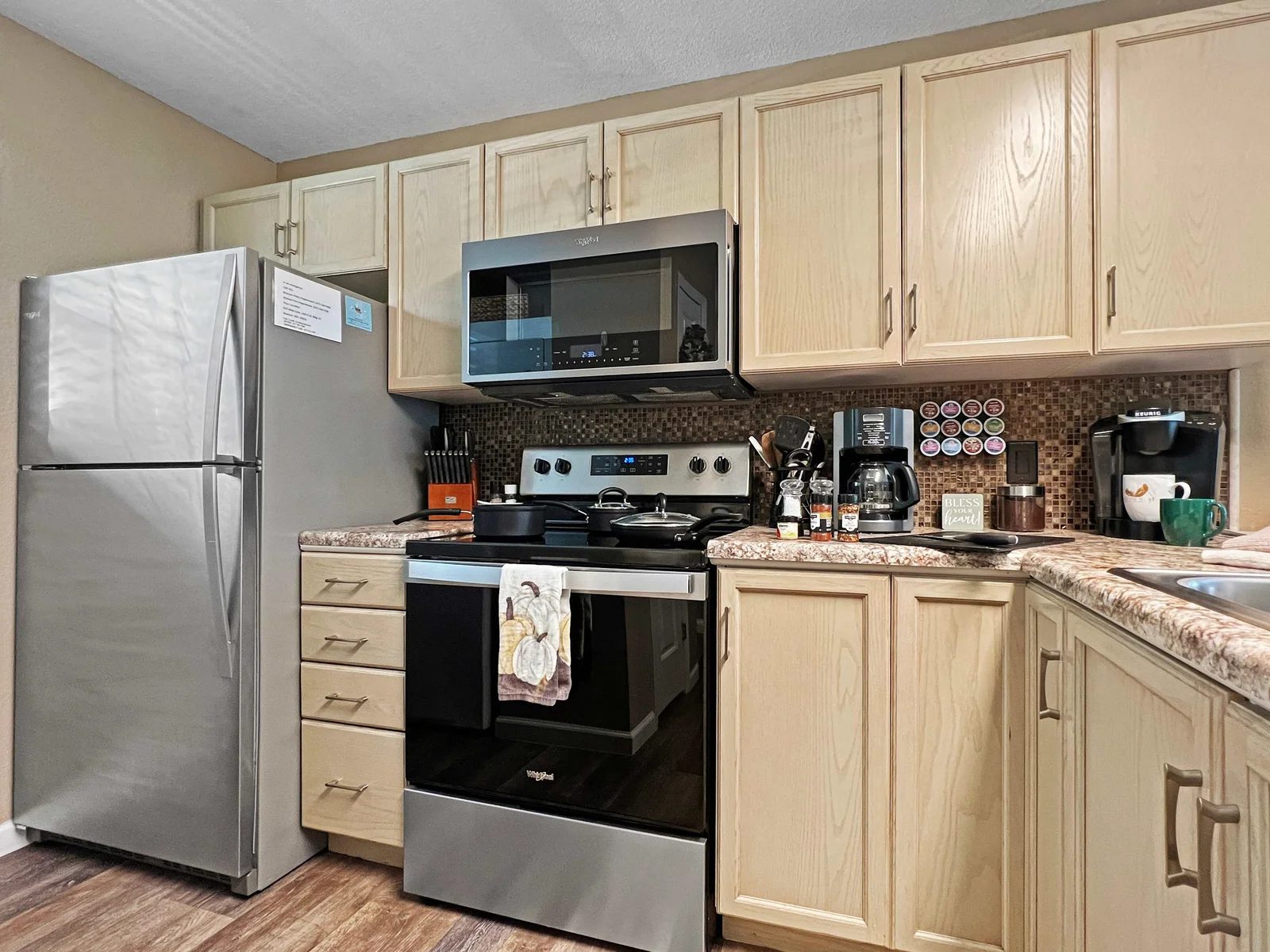 Beautiful kitchen with all appliances, coffee makers, pots, pans and all of the necessary essentials.