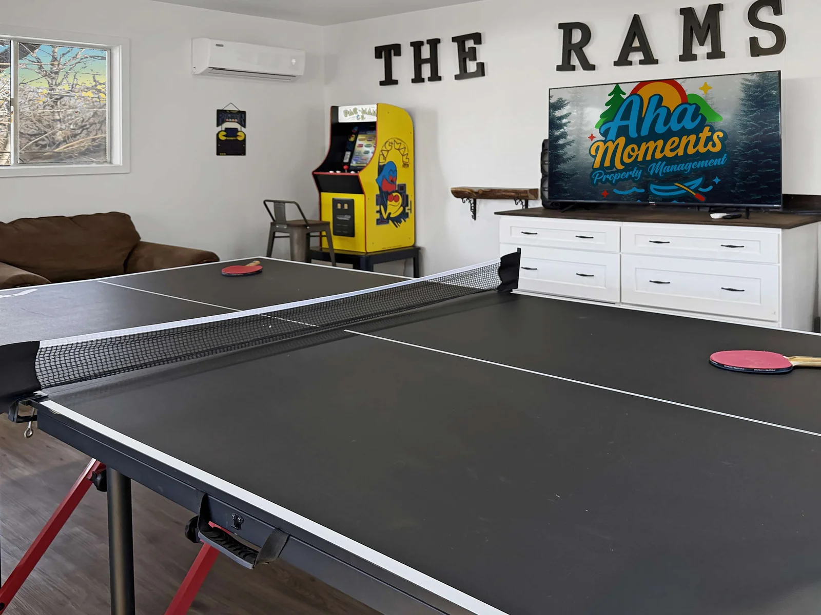 Super Fun ping pong table and video game at Rams Den 1 in the giant game room