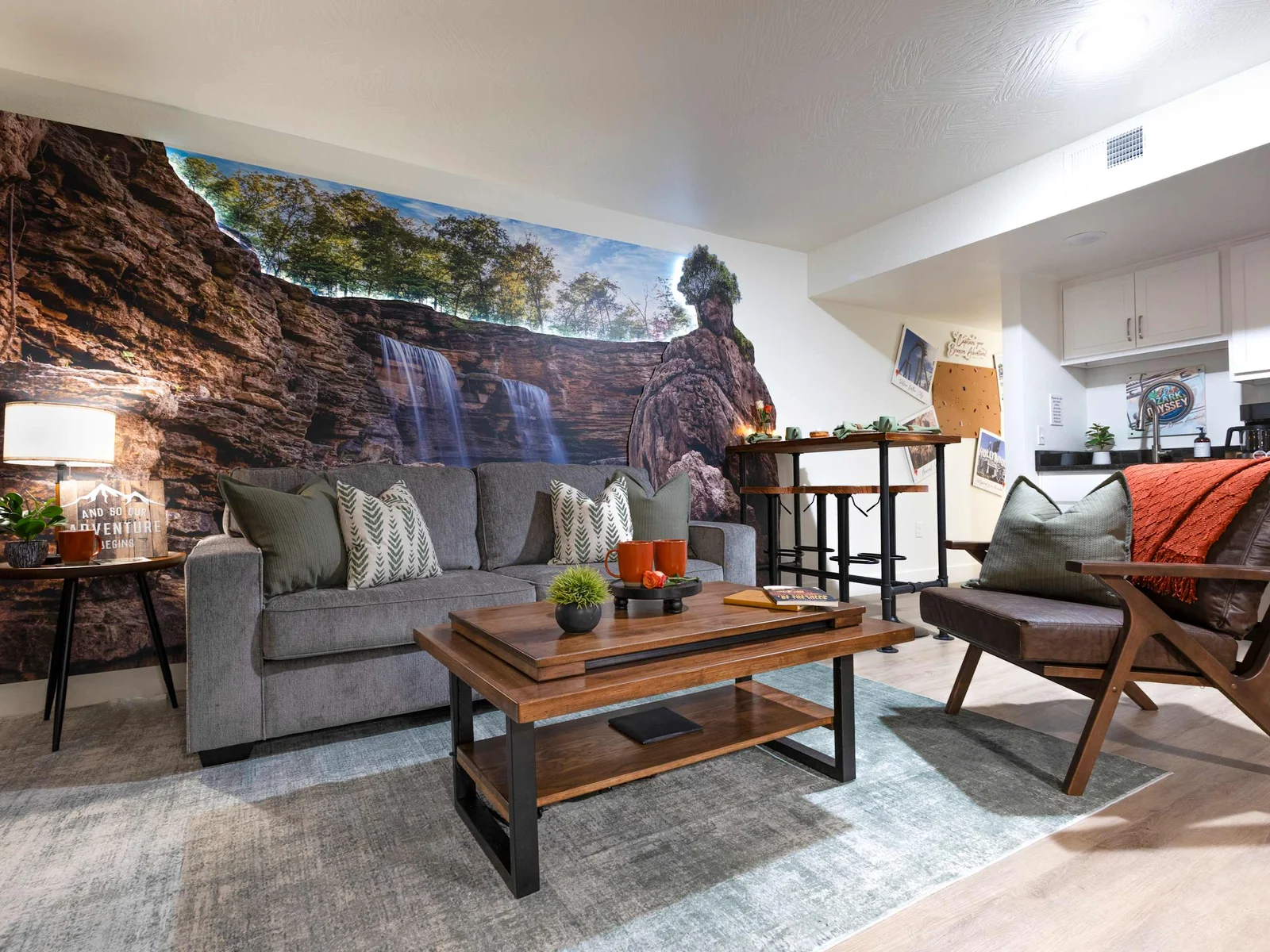 Welcome to Ozark Odyssey, where you'll be greeted by gorgeous, wrap-around artwork in the living room that makes you feel like you're standing at the foot of a majestic waterfall