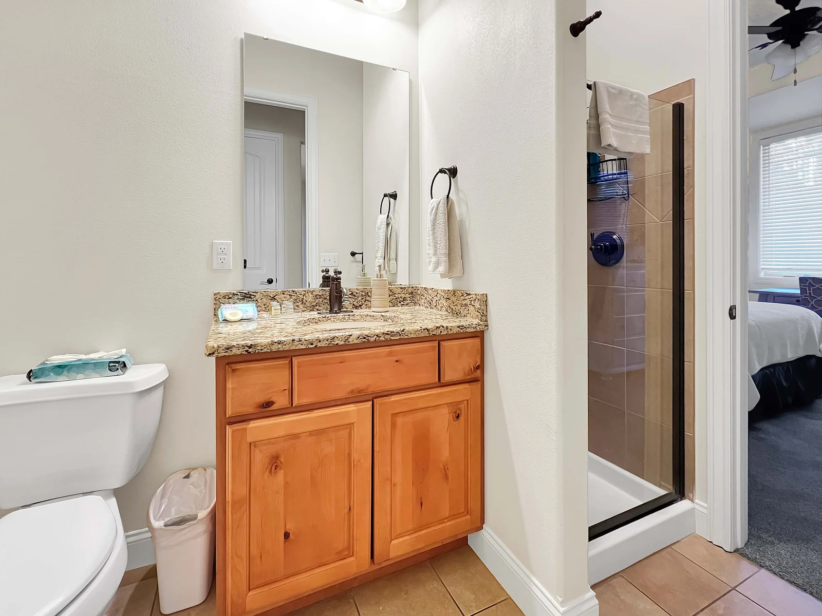 This ensuite has a tile shower and vanity