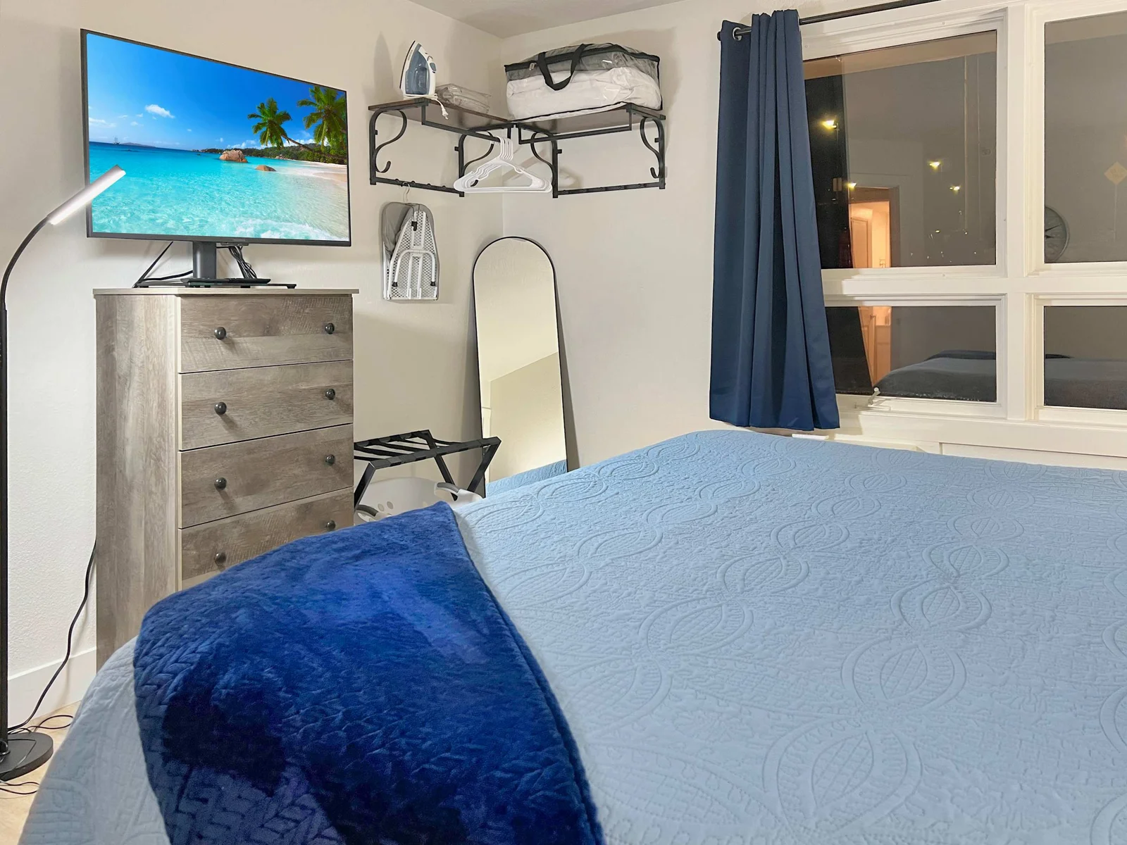 King Suite offers a side chair and 45" Insignia FireTV.