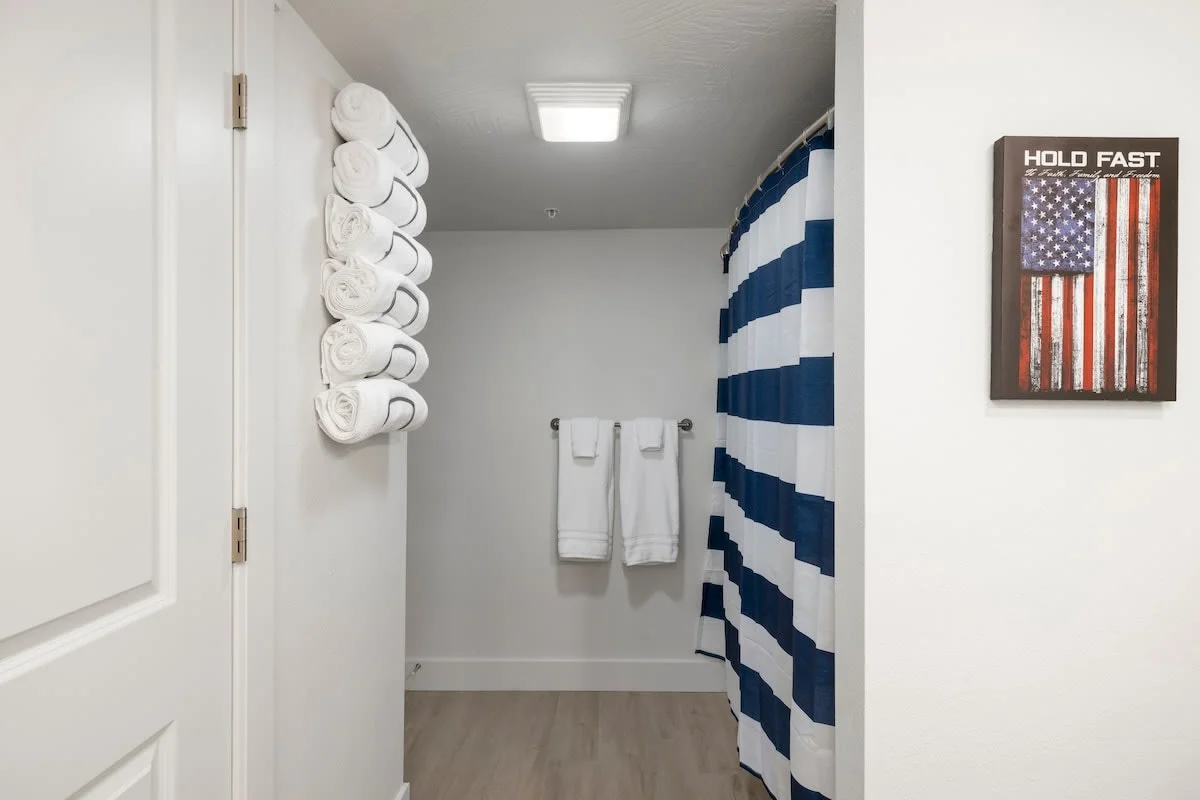 The spacious ensuite bathroom provides a tub/shower combo.