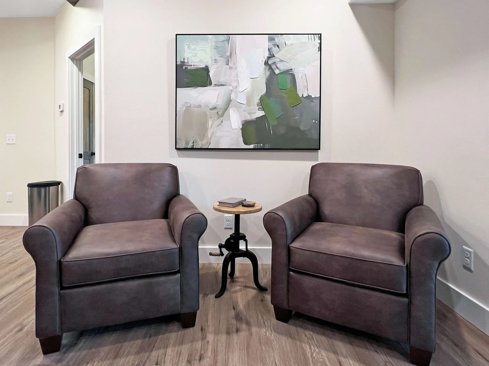 Comfy, reading nook with soft plush leather chairs to sink down into and forget the world outside