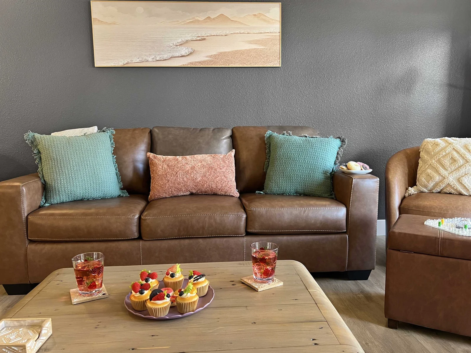 Gorgeous leather sofabed and swivel chair in this immaculate living area