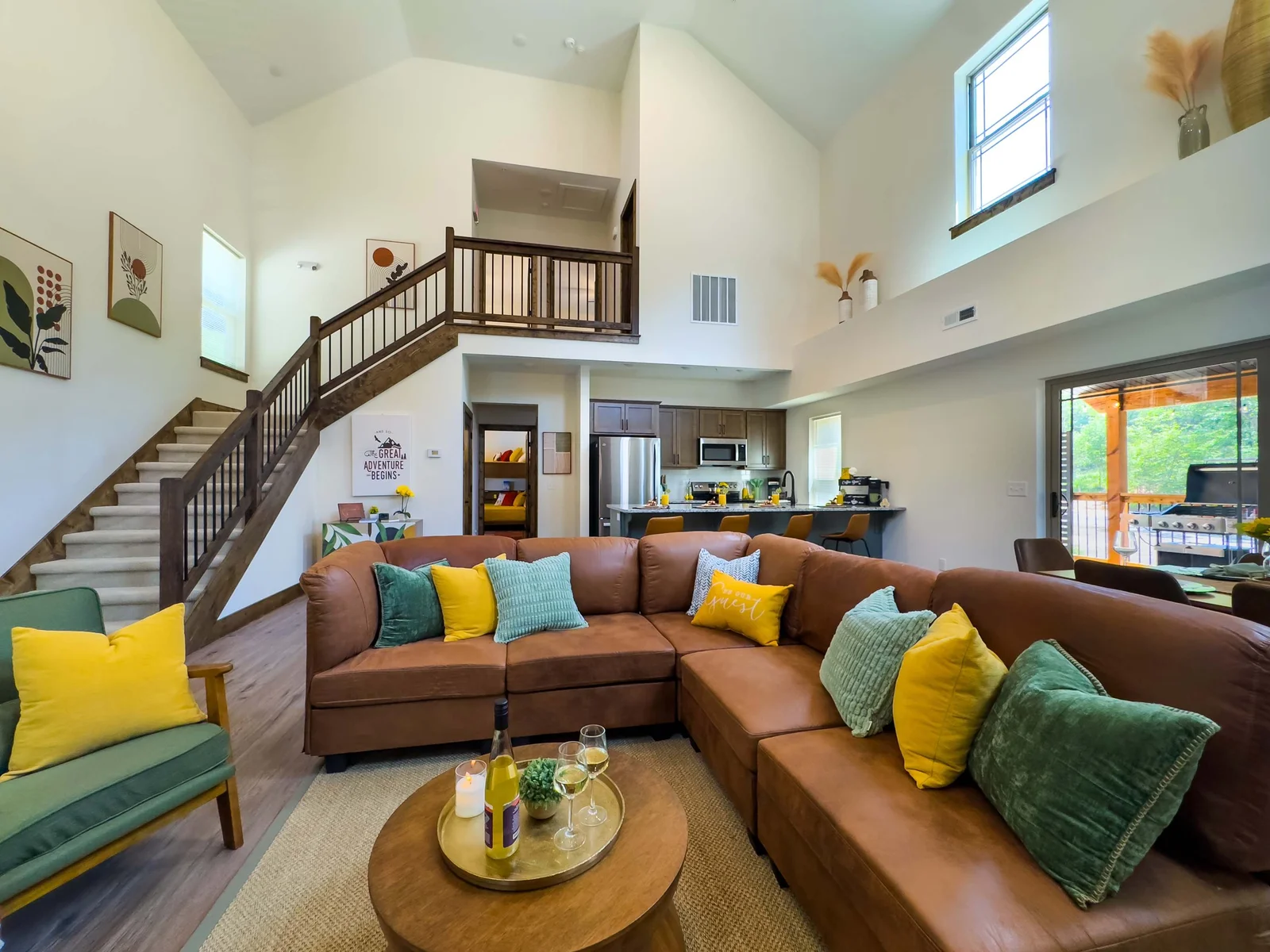 Plush furnishings, beautiful finishes, and large picture windows create a space that's both dramatic and cozy—a perfect gathering place for conversation, card games, or quiet evenings with a glass of wine.
