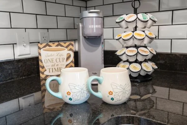 Our coffee bar includes a Keurig coffee machine and a good assortment of Kcups for you to enjoy!!