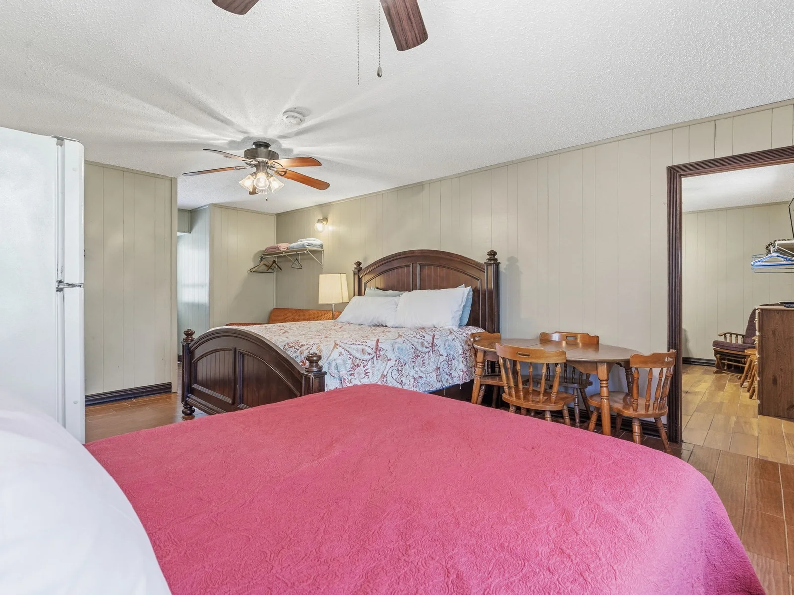 Studio bedroom with king and double bed, viewing entryway to bedroom 2