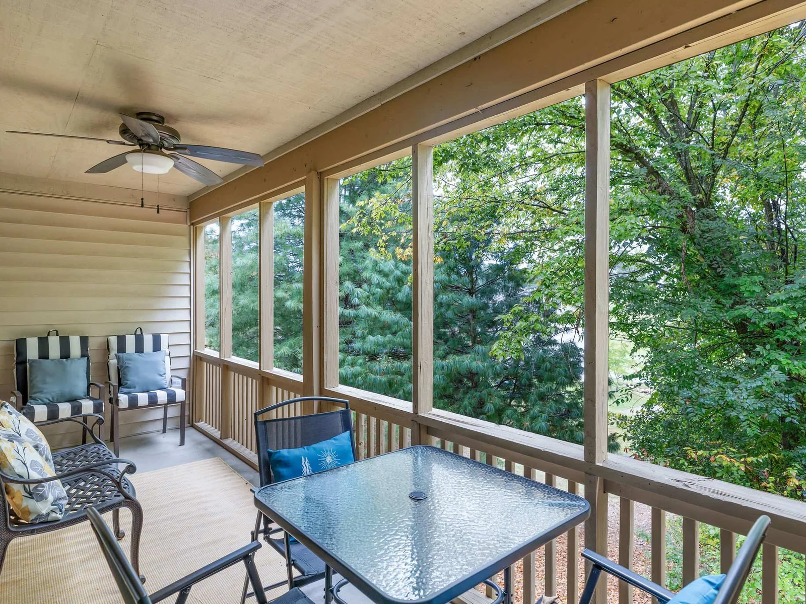 Cozy up on the patio with plenty of outdoor seating for the group! Kept secluded behind the trees, but still overlooking the golf course for some great views, you can hear the water from the nearby stream as you relax.