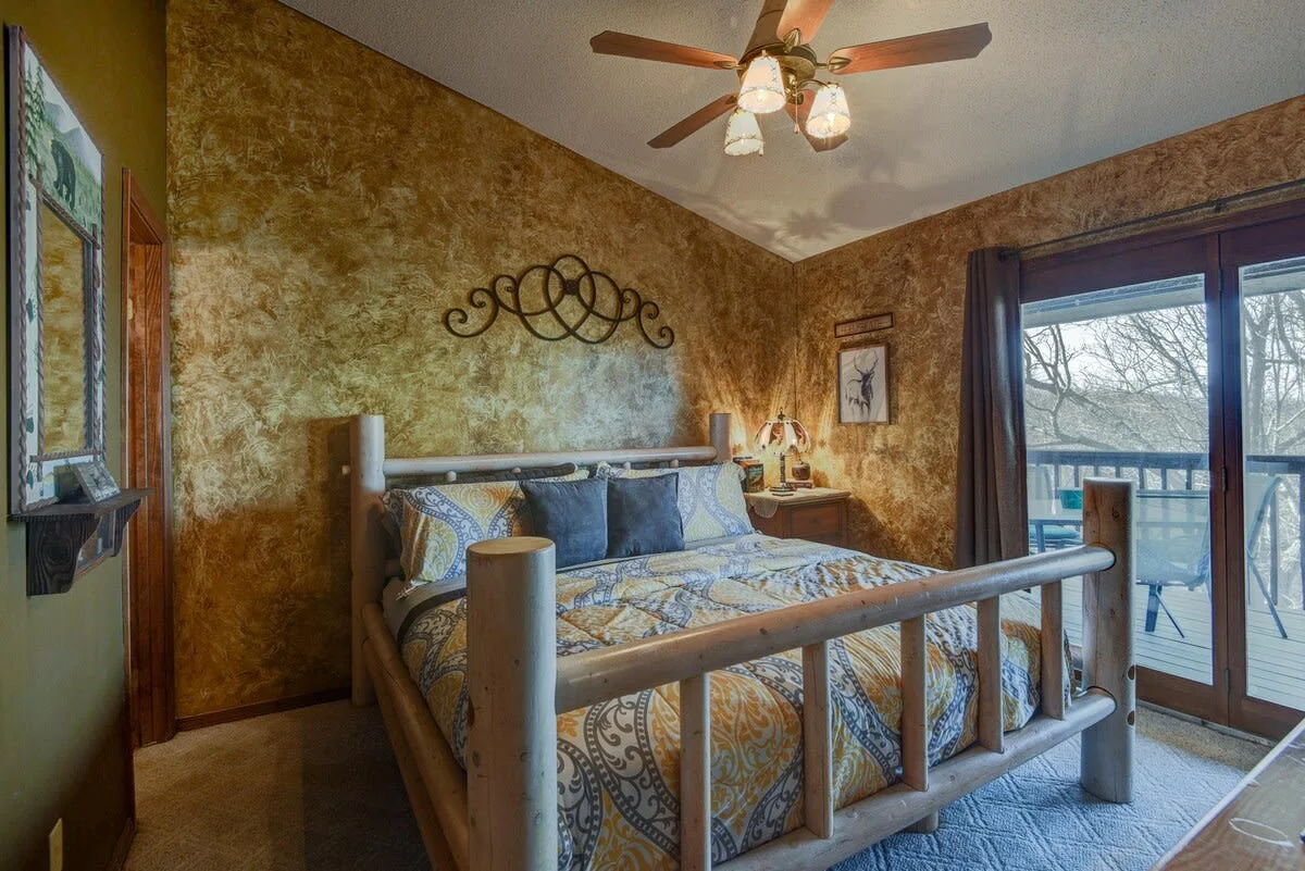 King bedroom with attached bathroom & walkout access to private back porch!