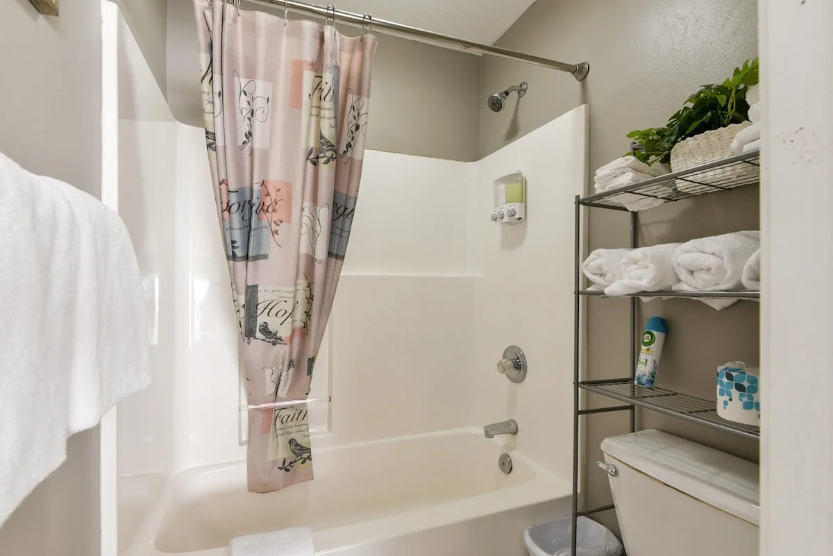 Shower/Tub combo attached to double queen room.