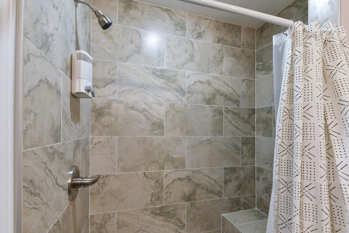 Primary bedroom bathroom - walkin shower with bench (small step inside)