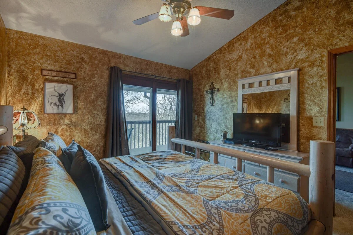 King bedroom with attached bathroom & walkout access to private back porch!