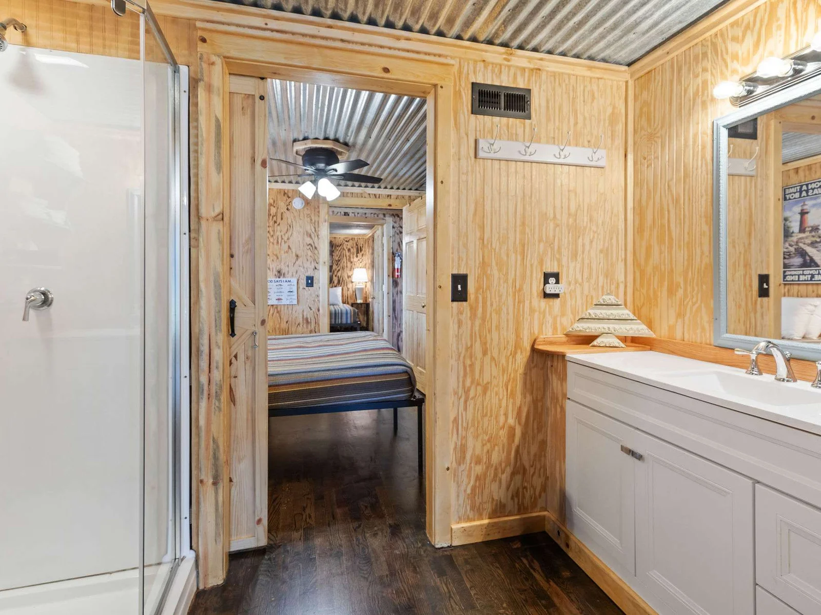 Bathroom with step in shower, shared between bedrooms.