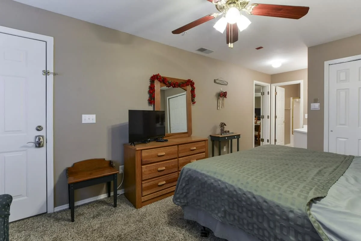 Guest bedroom with walkout access to the front porch as well as it's own bathroom.