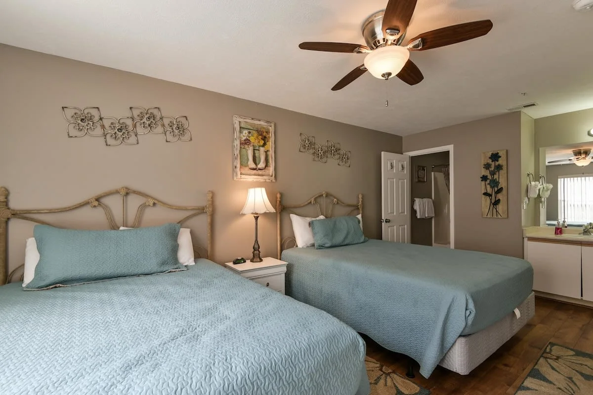 Two queen beds with attached bathroom.