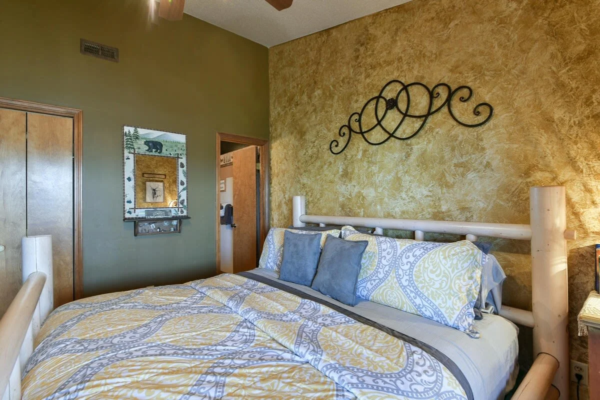 King bedroom with attached bathroom & walkout access to private back porch!