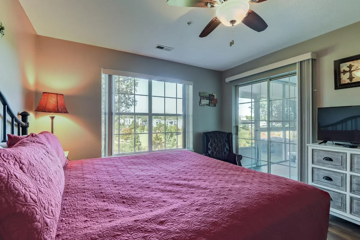 King bedroom with walk out access to back enclosed patio