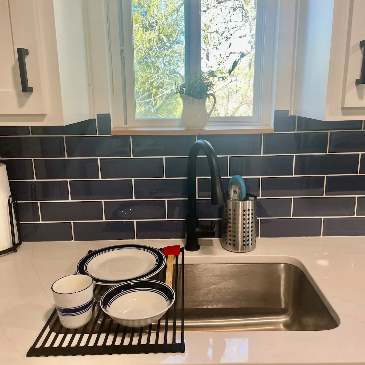 Deep kitchen sink with enough counter space for food prep.