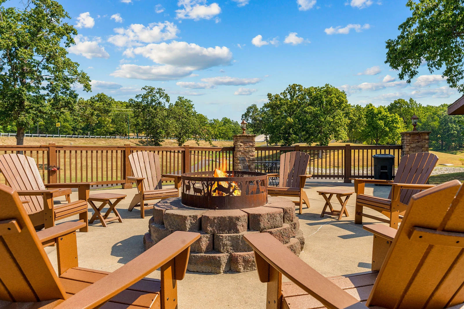 Shared community fire pit ringed with Adirondack chairs. Bring the s'mores and stay for the stars.